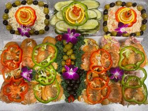 A tray of trays with different kinds of food in them.