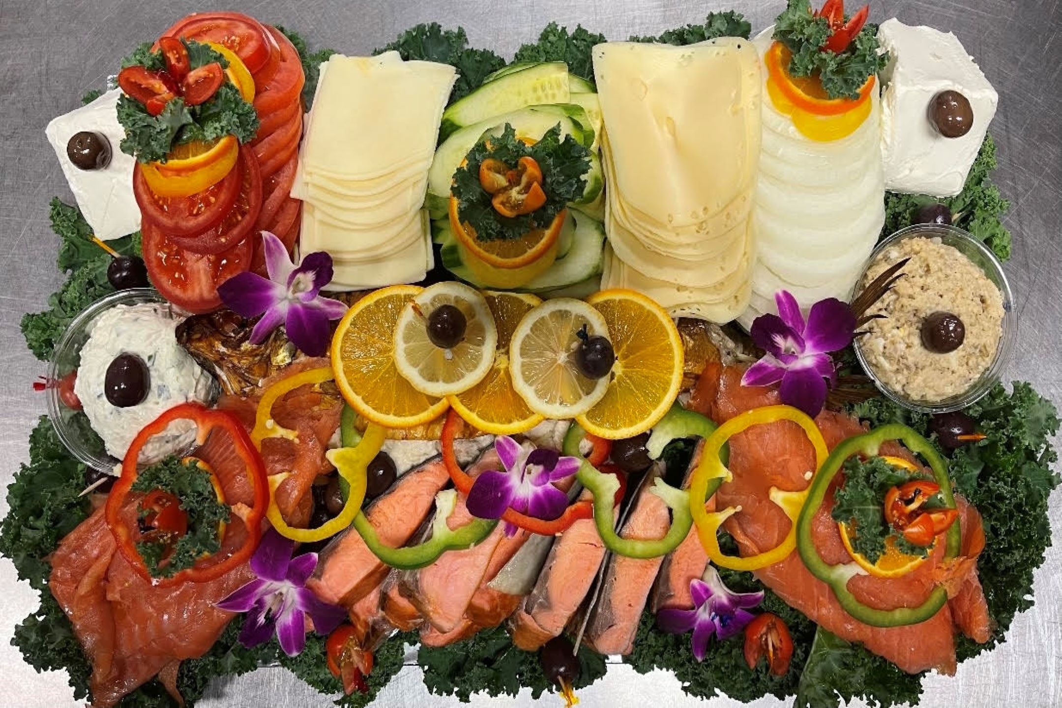A platter with a variety of seafood and vegetables.