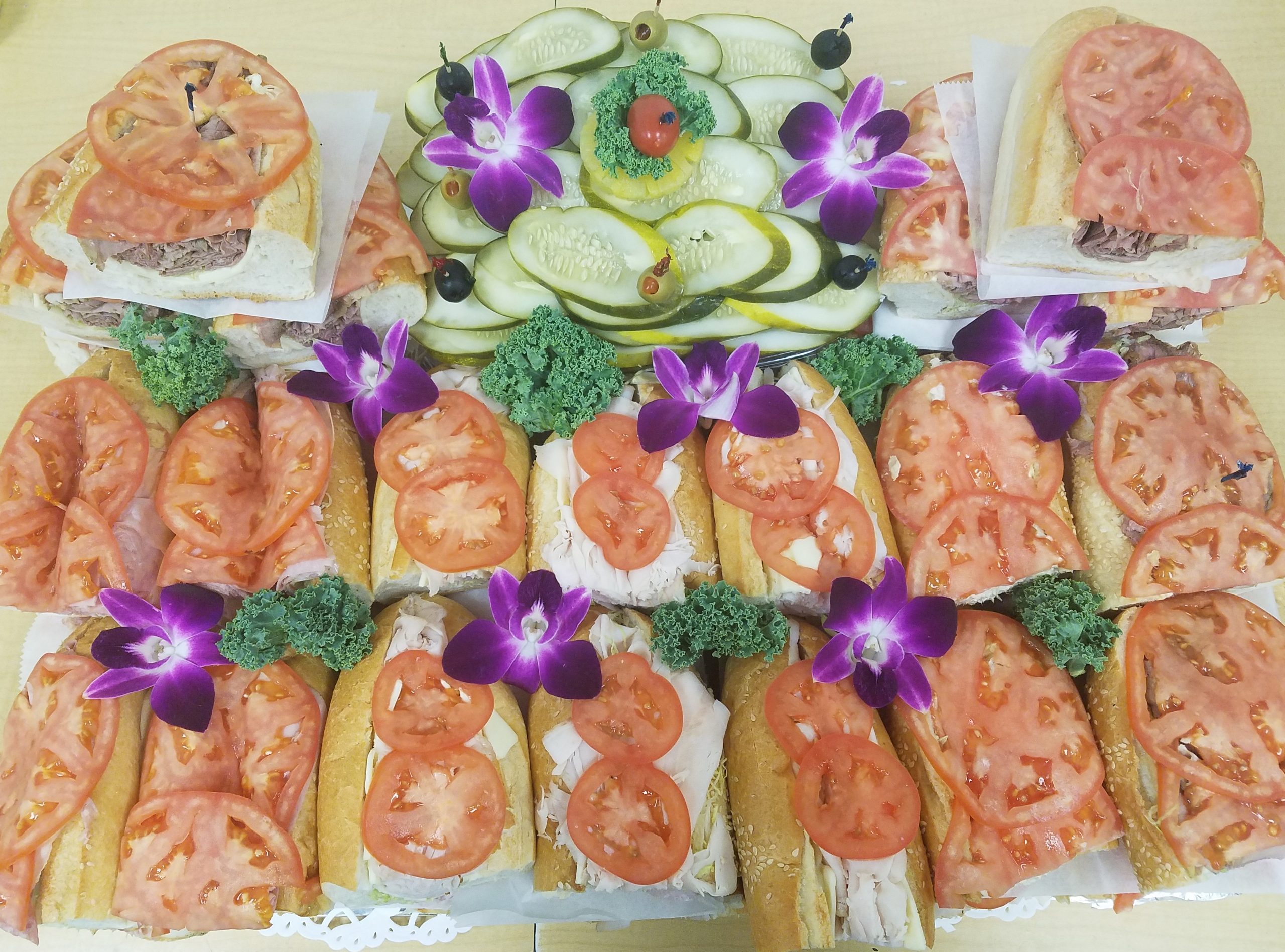 A tray of sandwiches on a table.