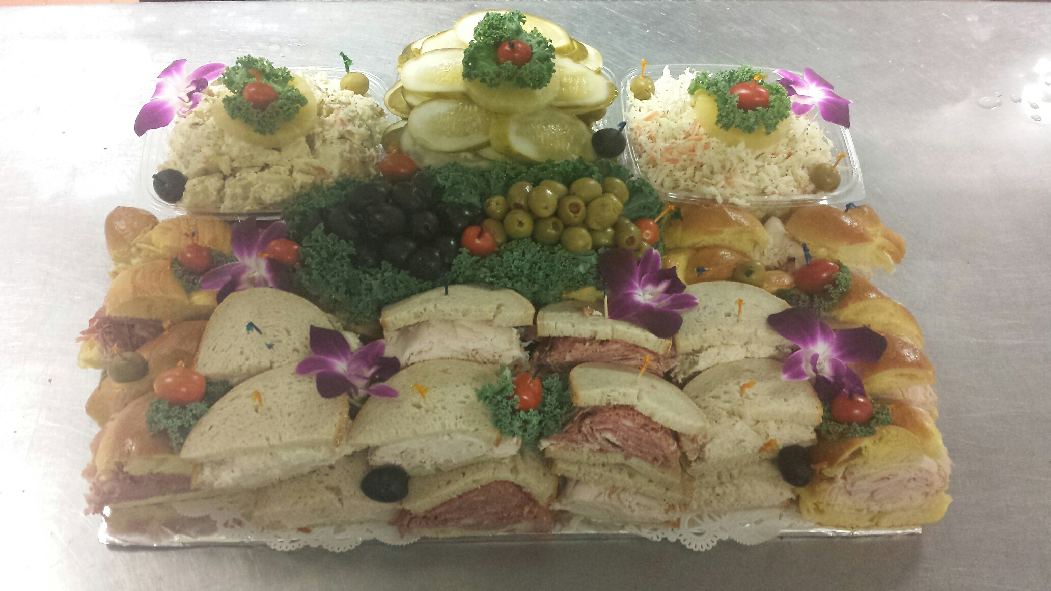 A tray with a variety of food on it.